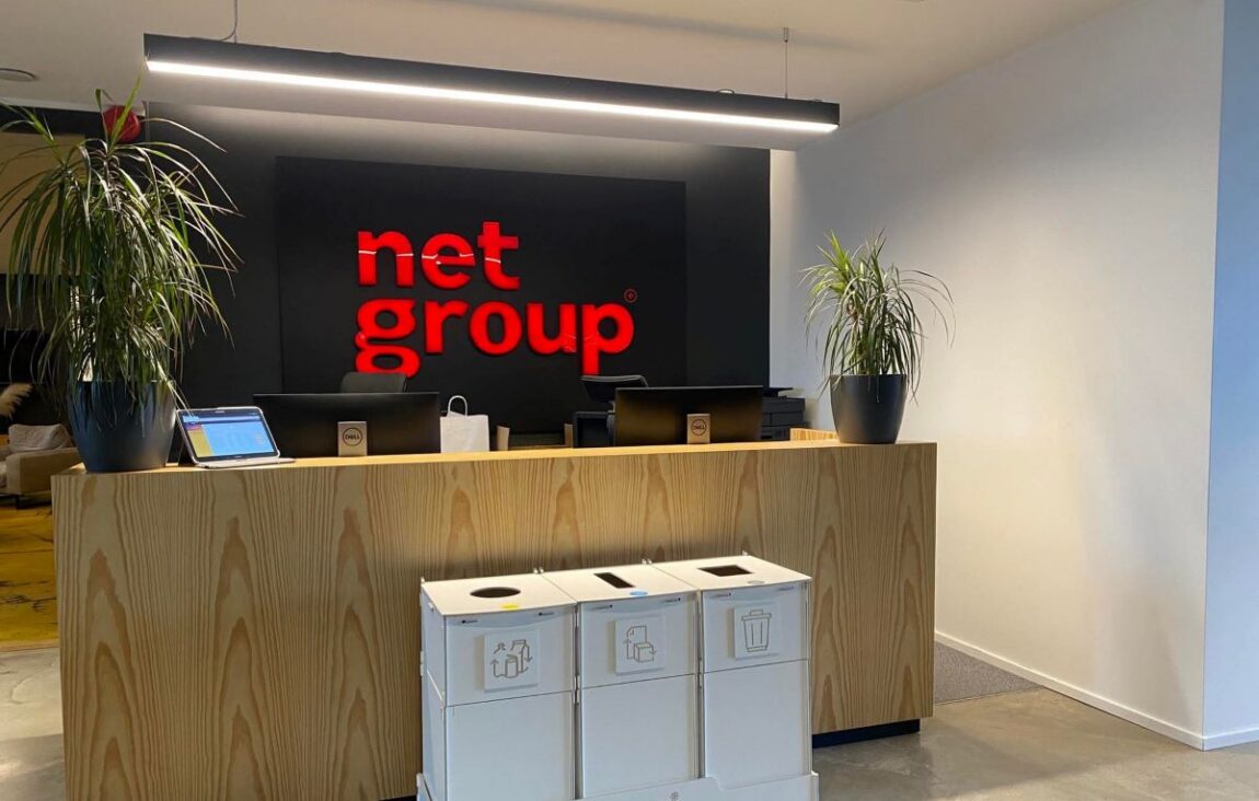 Indoor recycling bins at Net Group office reception, designed for paper, packaging, and mixed waste sorting.