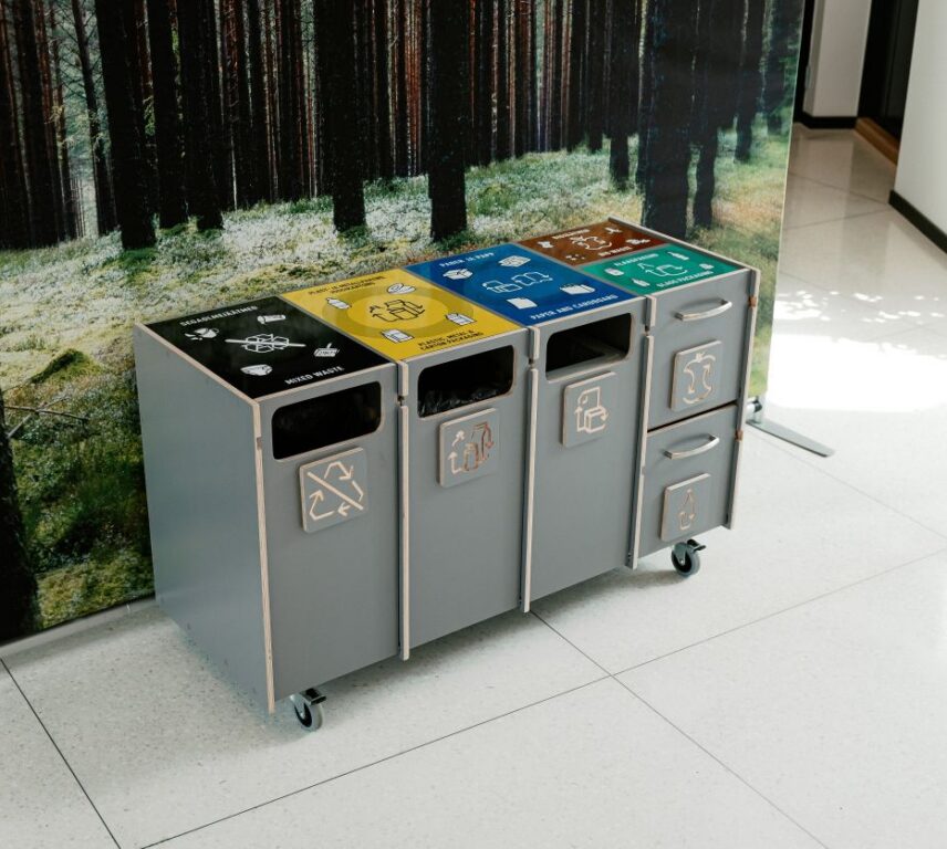 Recycling bins for universities and colleges with labeled compartments for mixed waste, plastic, paper, and bio waste.