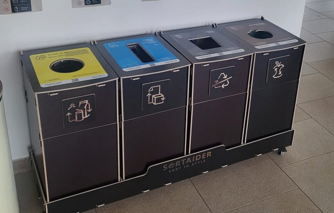 Sortaider multi-compartment recycling bins installed at office for plastic, paper, packaging, and general waste.