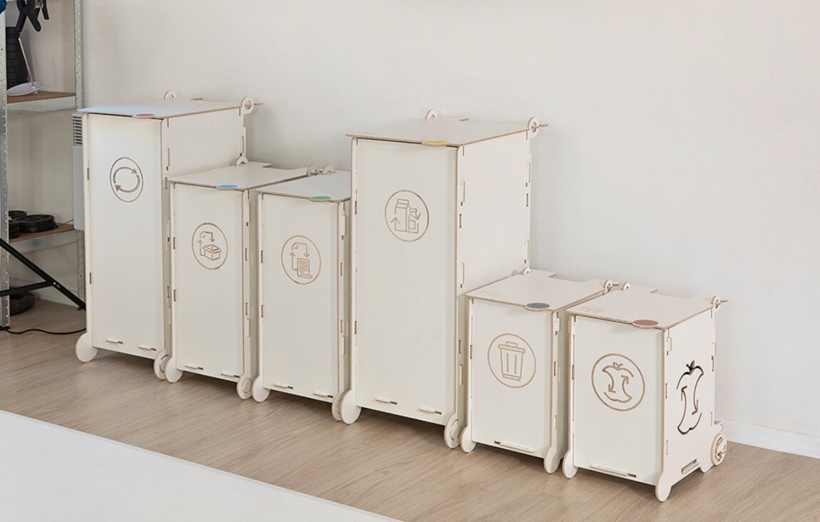 White clinical waste bins with symbols for paper, packaging, mixed, and bio waste, designed for healthcare facilities and laboratories.