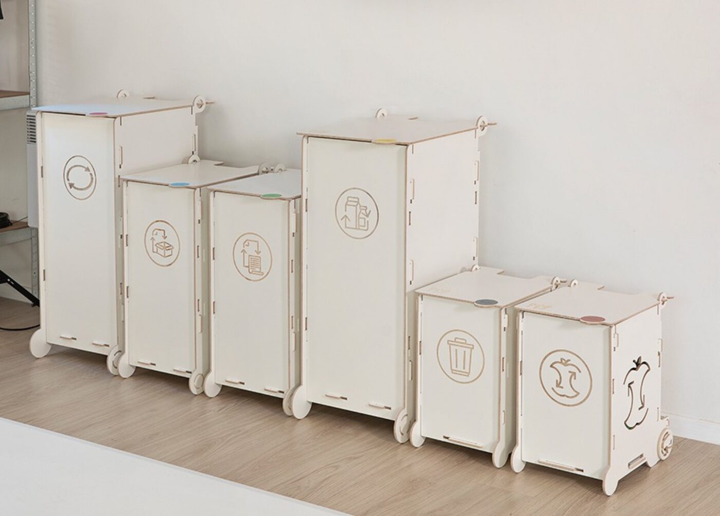 White clinical waste bins with symbols for paper, packaging, mixed, and bio waste, designed for healthcare facilities and laboratories.