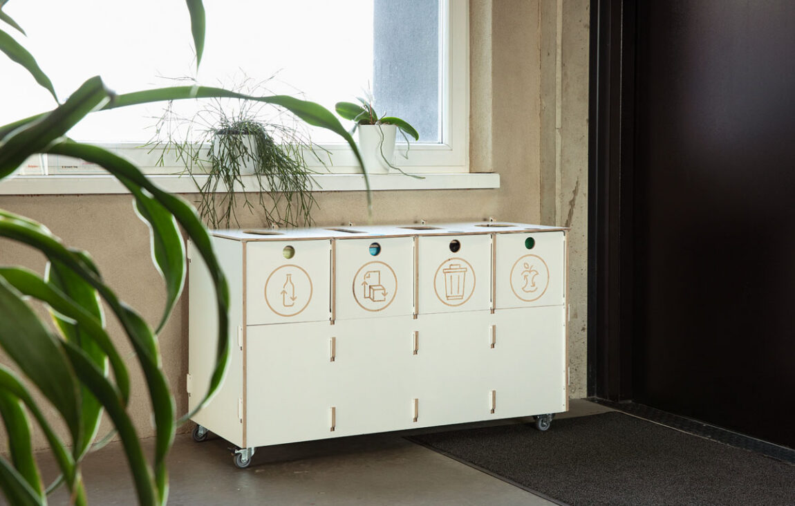 Modern office interior featuring recycling bins for paper, plastic, mixed waste, and biowaste, installed at Estonian Traffic Insurance Fund – Sortaider.