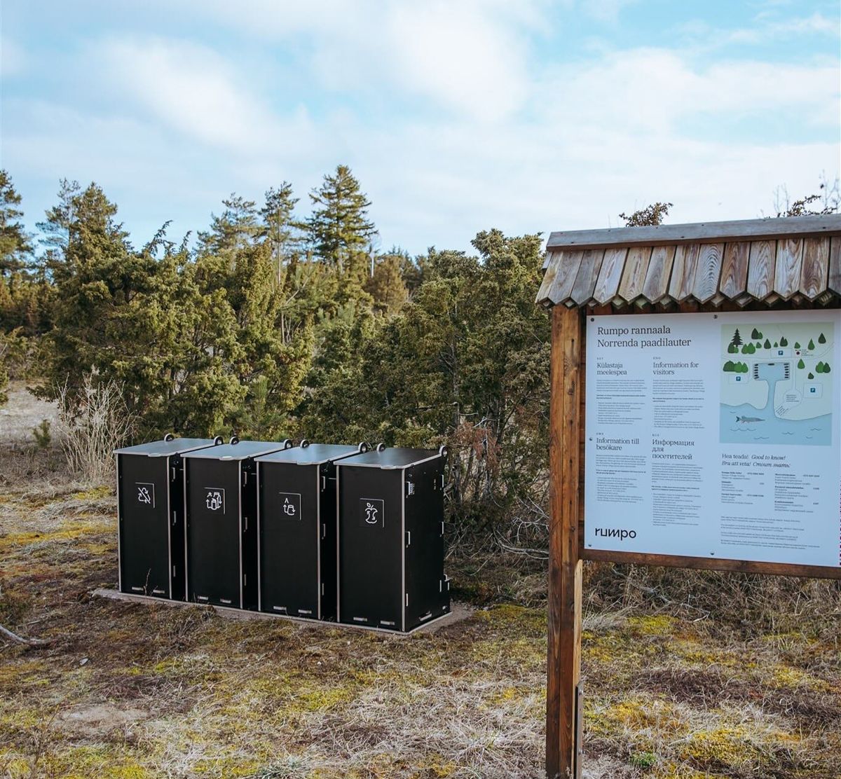 Outdoor plywood waste sorting bins in a natural park area
