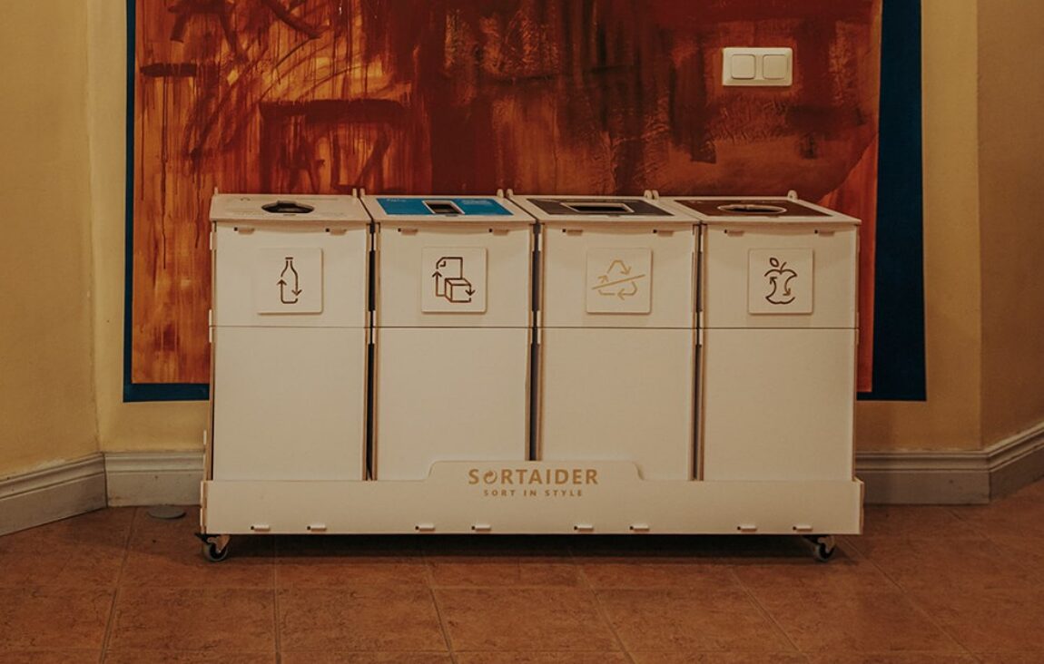 Recycling bins with modern designs used for efficient waste sorting in a modern business environment
