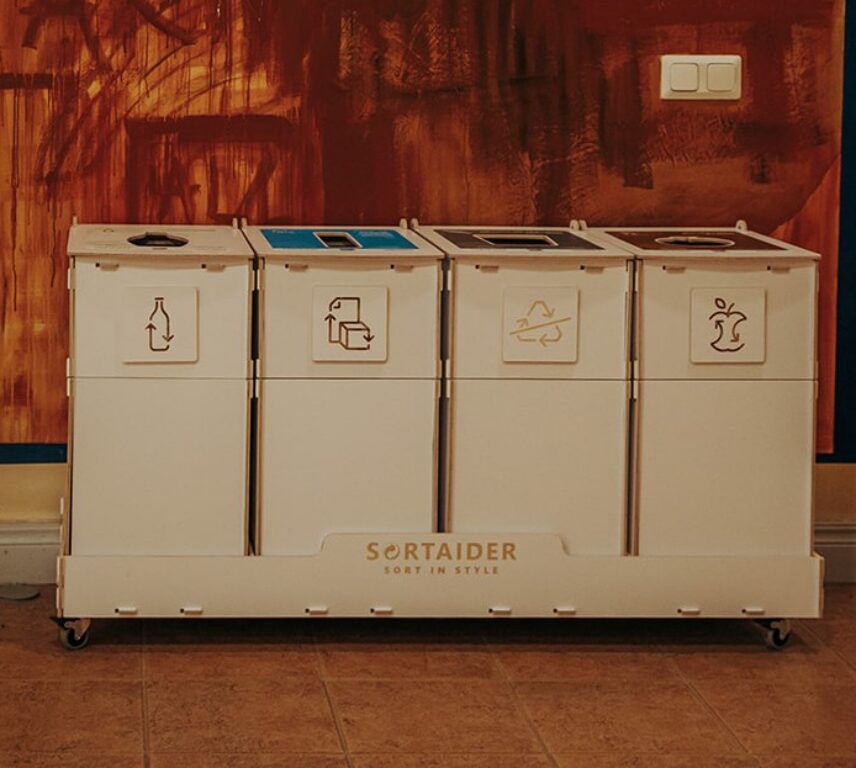 Recycling bins with modern designs used for efficient waste sorting in a modern business environment