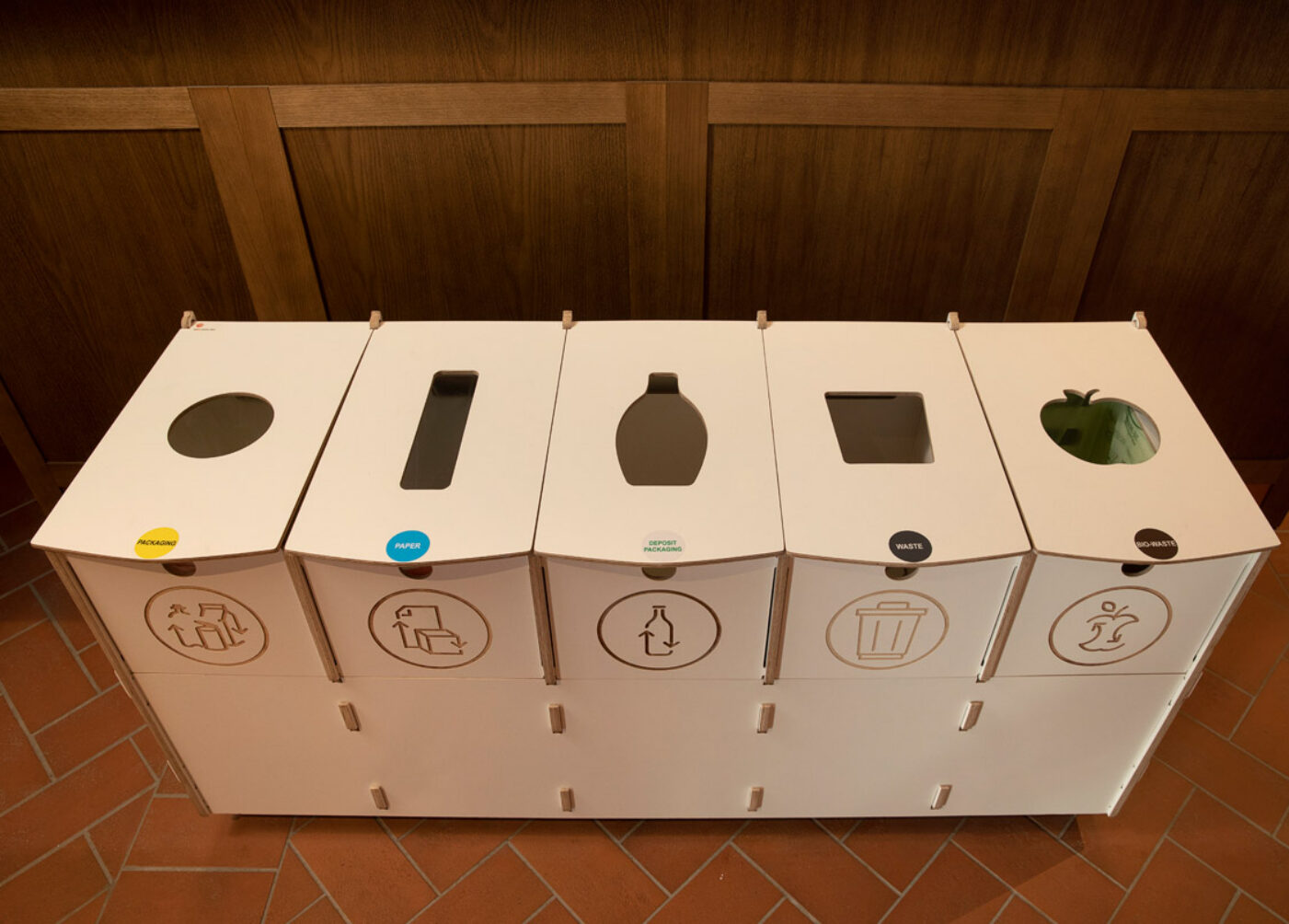 Recycling bins for employee areas placed in a staff space to support everyday recycling habits.