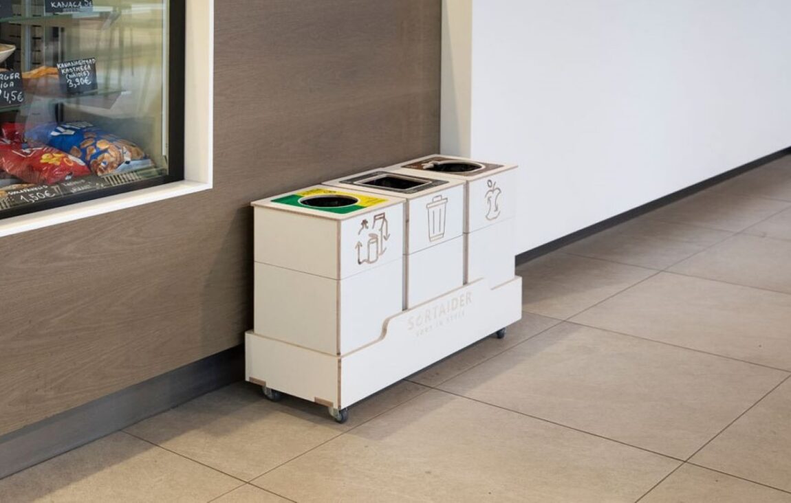 Recycling bins with multiple compartments allowing clear separation of different waste types.