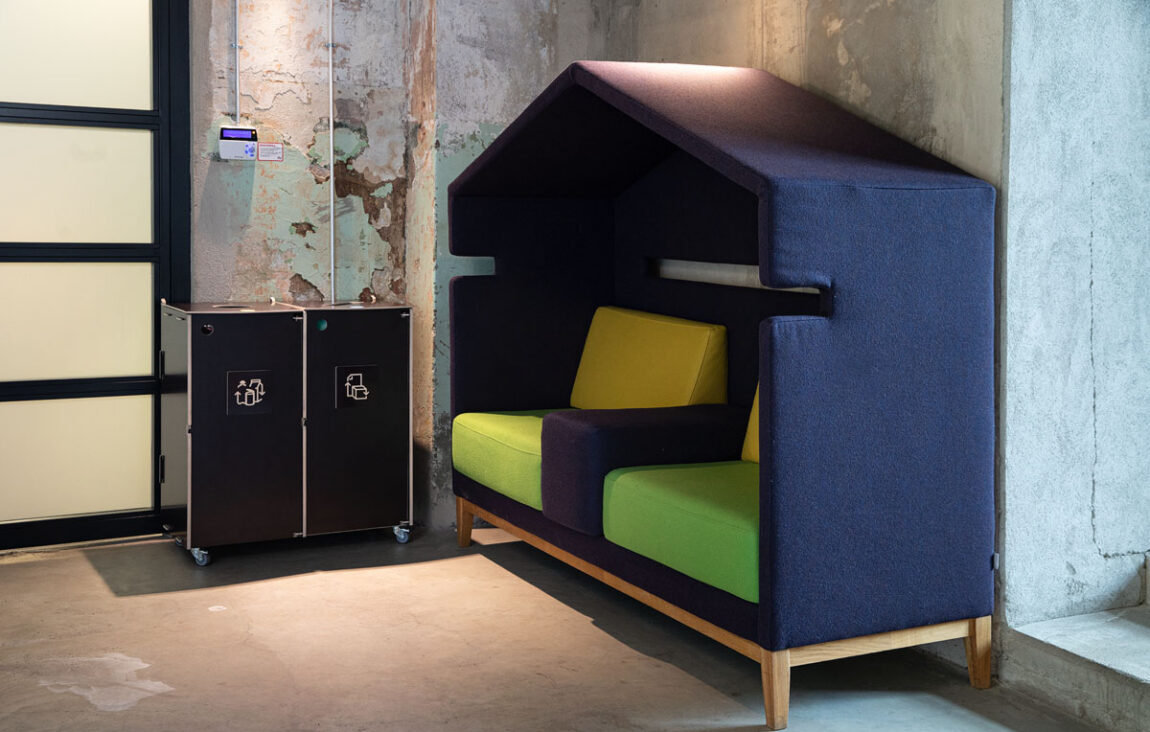 Waste bins for internal office zones placed along corridors to support intuitive waste sorting.