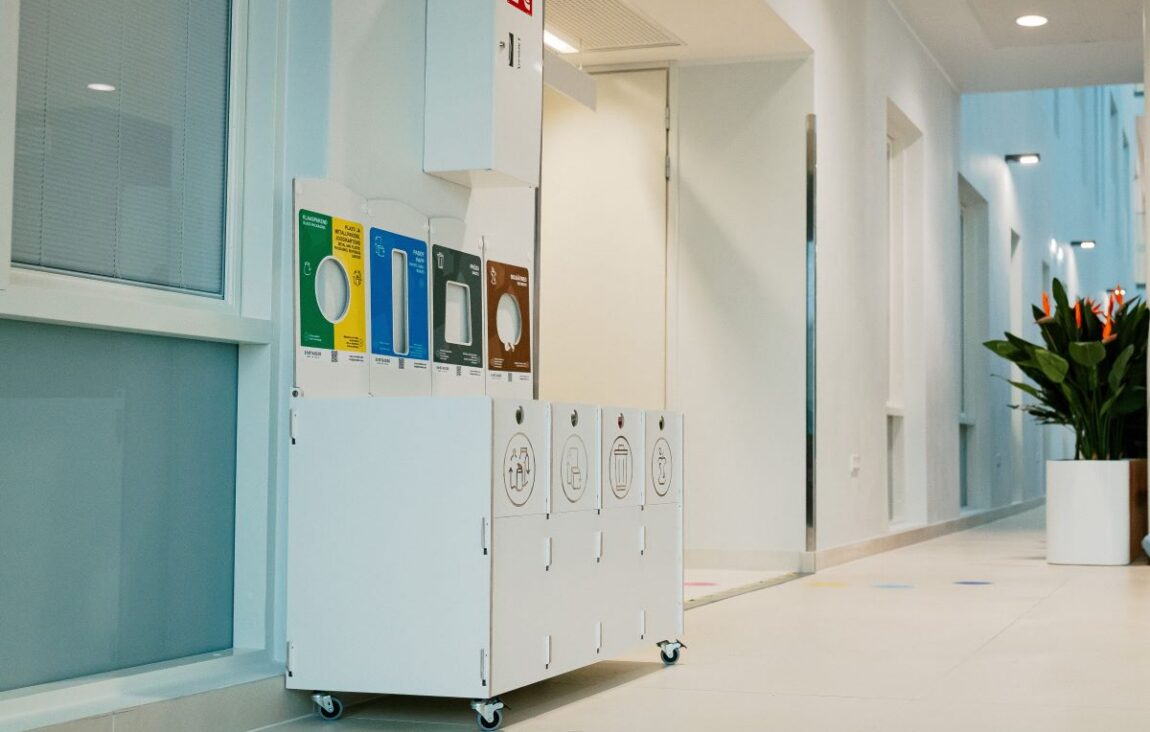 Waste bins for office corridor placed at corridor ends to support disposal.