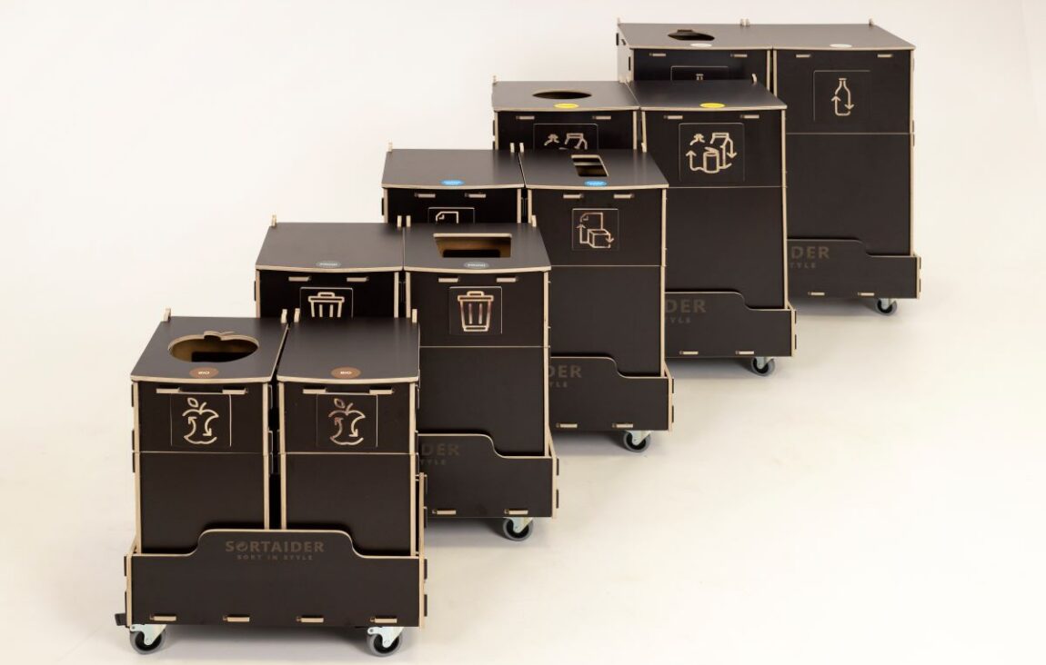 Waste bins for office lounges placed in a relaxed seating area to support casual waste sorting.