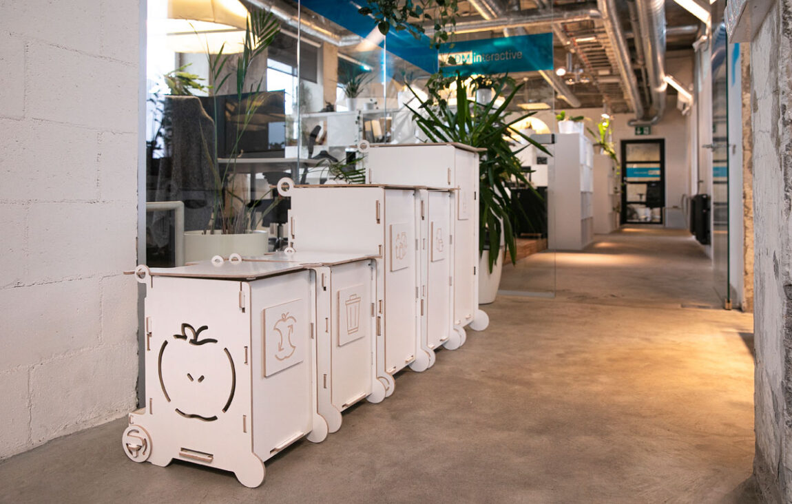 Waste bins for office with lids in use, showing a clean and contained waste sorting setup.