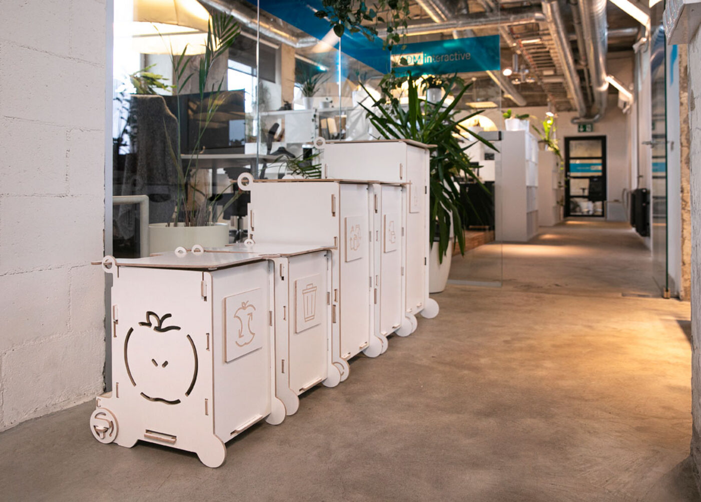 Waste bins for office with lids in use, showing a clean and contained waste sorting setup.