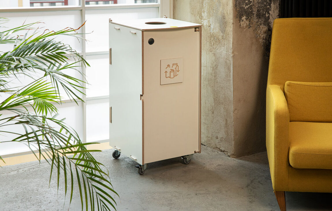 Waste bins for public spaces positioned in a busy walkway to support quick, intuitive waste sorting.